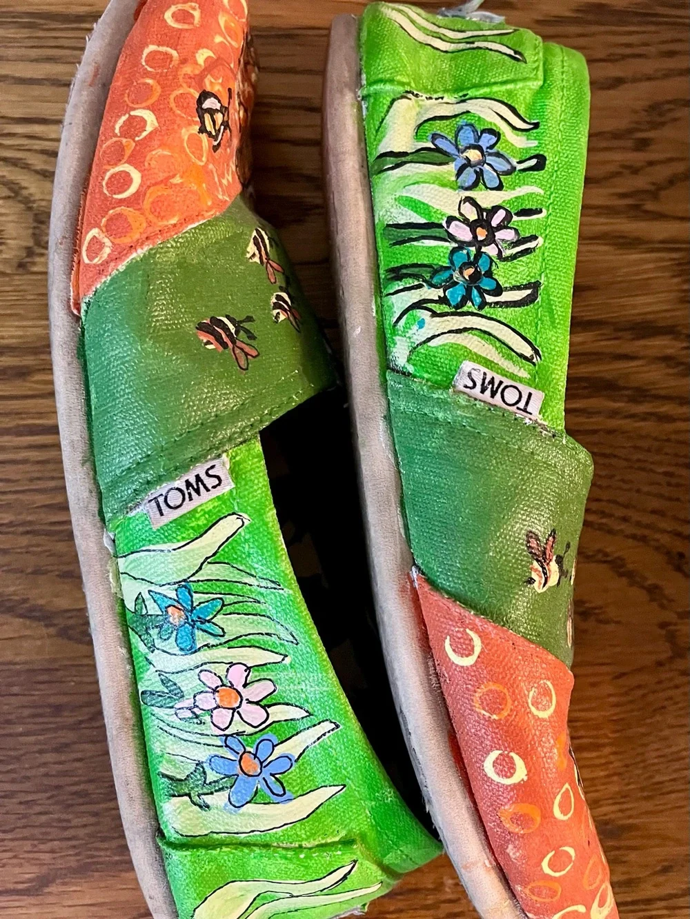 Toms Hand painted Green & Orange Bee Graphic Slip-On Shoes.